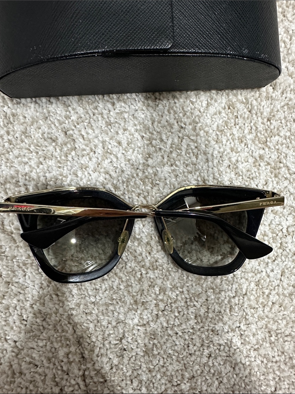 Prada Black and Gold Cat-Eye Sunglasses